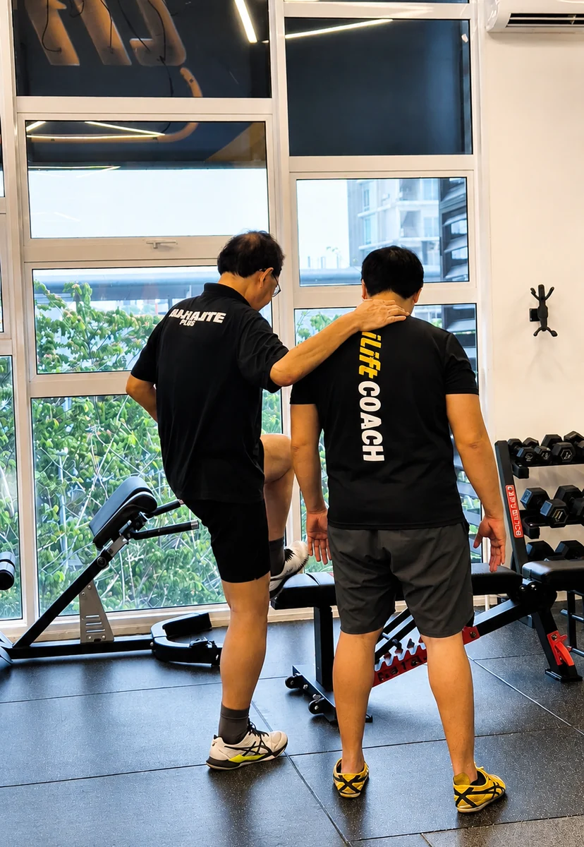 iLift coaches working with a client at the Kuching studio, one-to-one.
