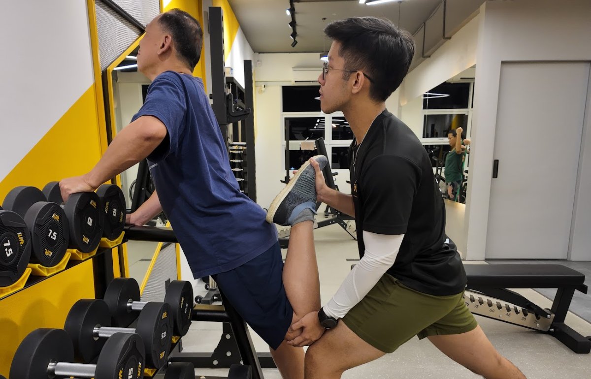 Jonathan working on knee mobility with Coach Ben at iLift