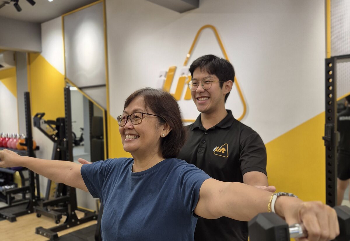 A coach working one-to-one with a client at iLift