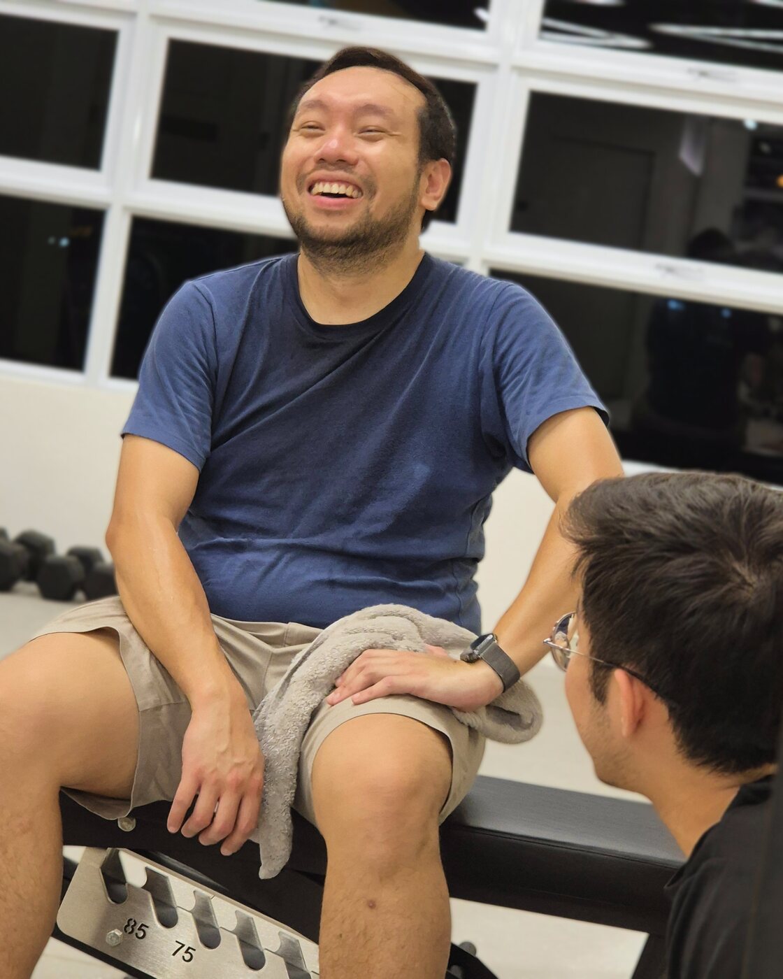 A middle-aged adult training with a coach at iLift