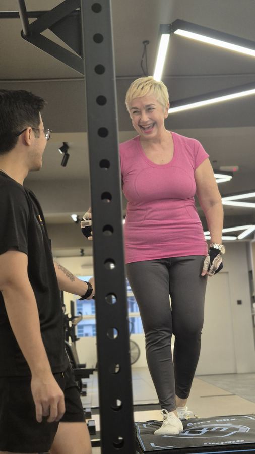A happy iLift client with her coach